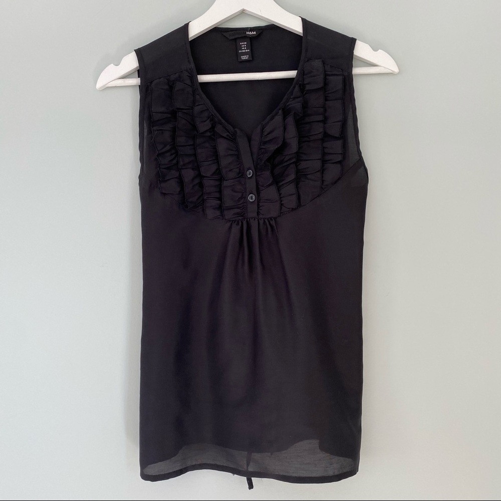 Black ruffle front sleeveless blouse